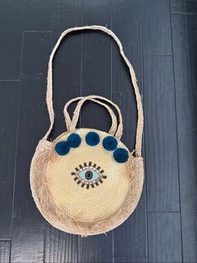 Straw Round Crossbody Bag with Teal Pom-Poms and Evil Eye Embroidery